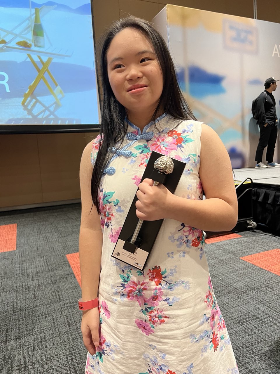 Megan Tang holding the Gong award, 2023